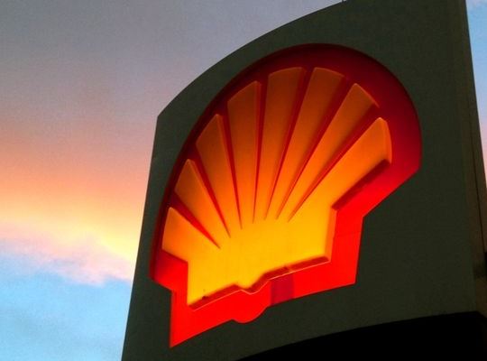 Shell sign at dusk