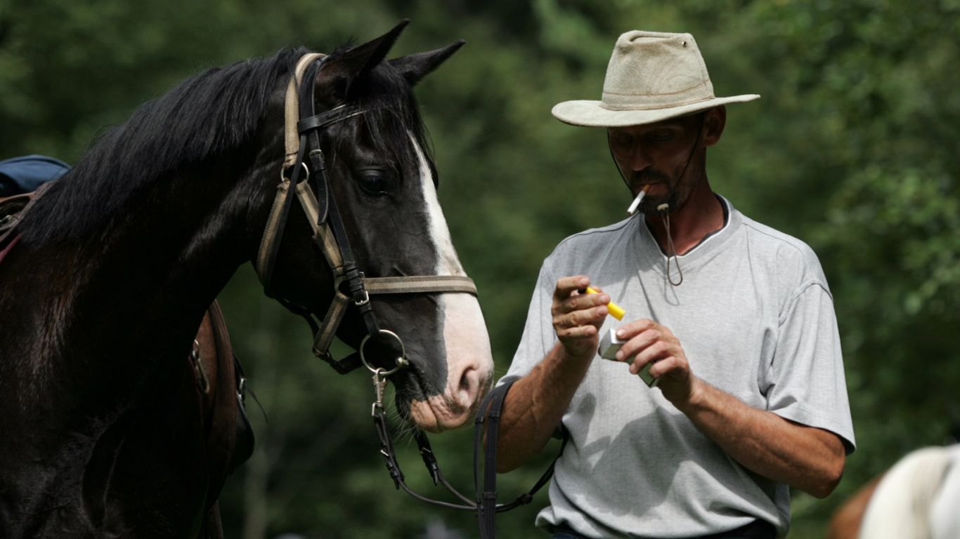 man with horse and cigarette