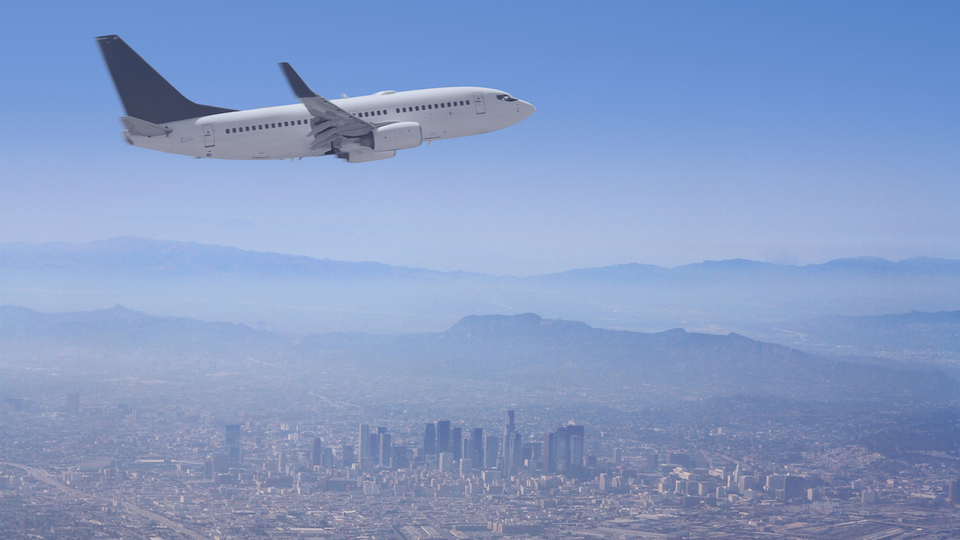 Los Angele Skyline with Airplane flying over, California