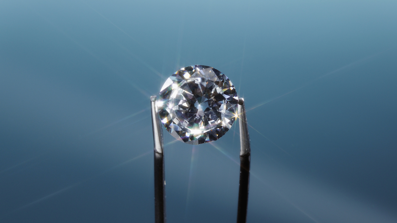 Tweezers holding diamond, close-up