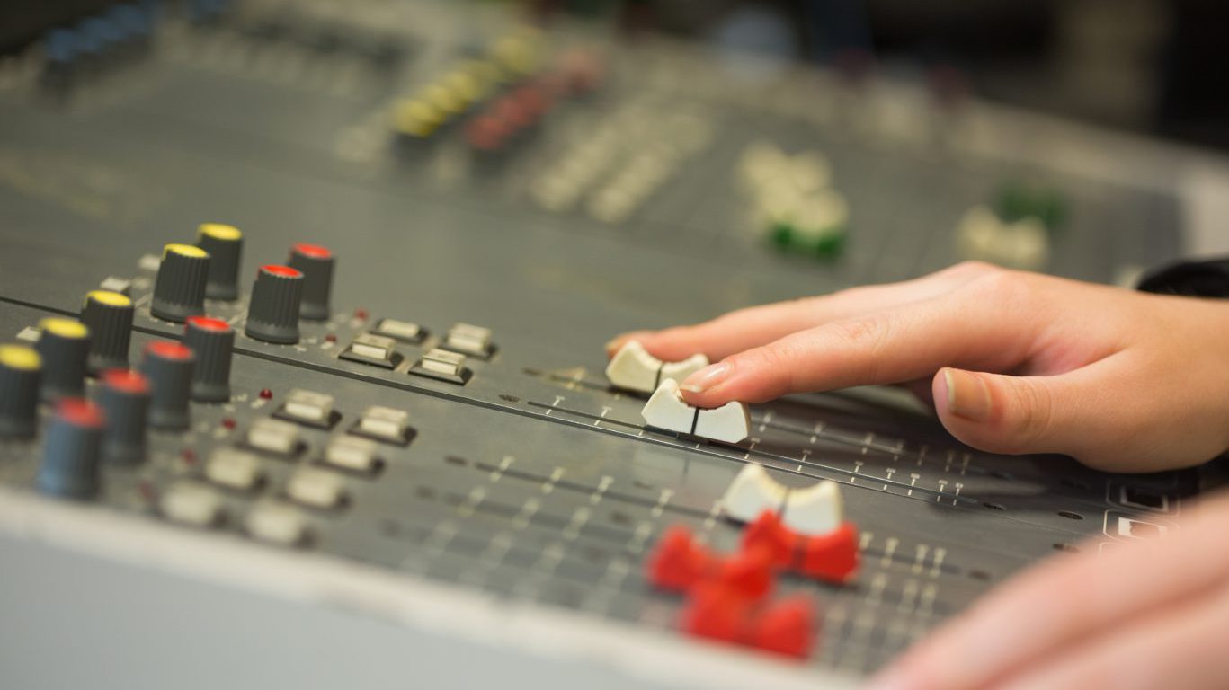 Student working on sound mixer