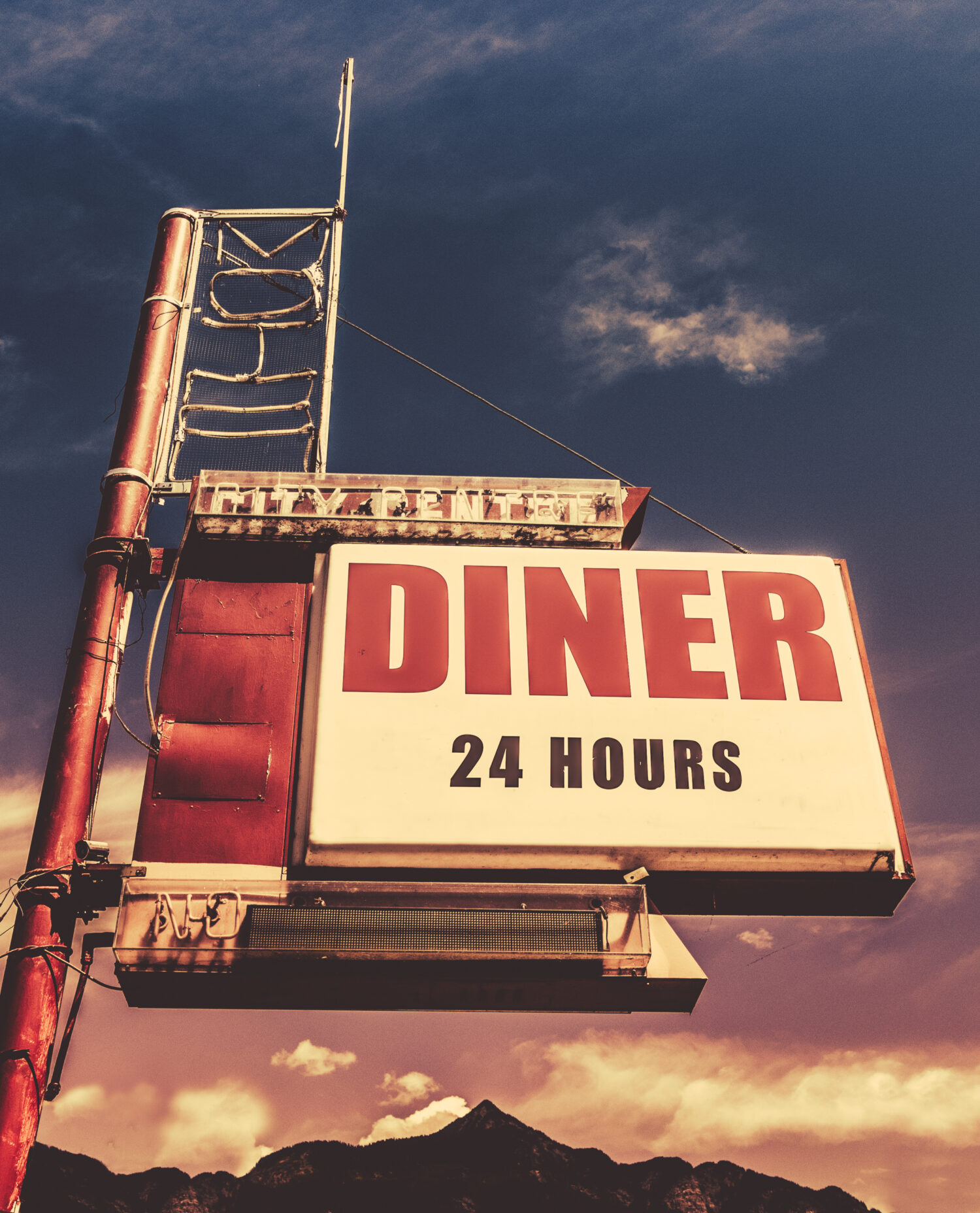 Retro Vintage Image Of Old Motel And Diner Sign In Small Town USA