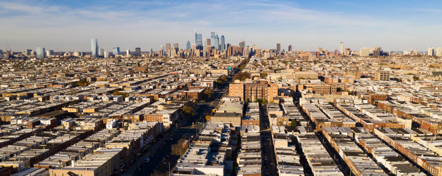 Row houses are lined up and attached to each other street by street all the way to downtown Philadelphia