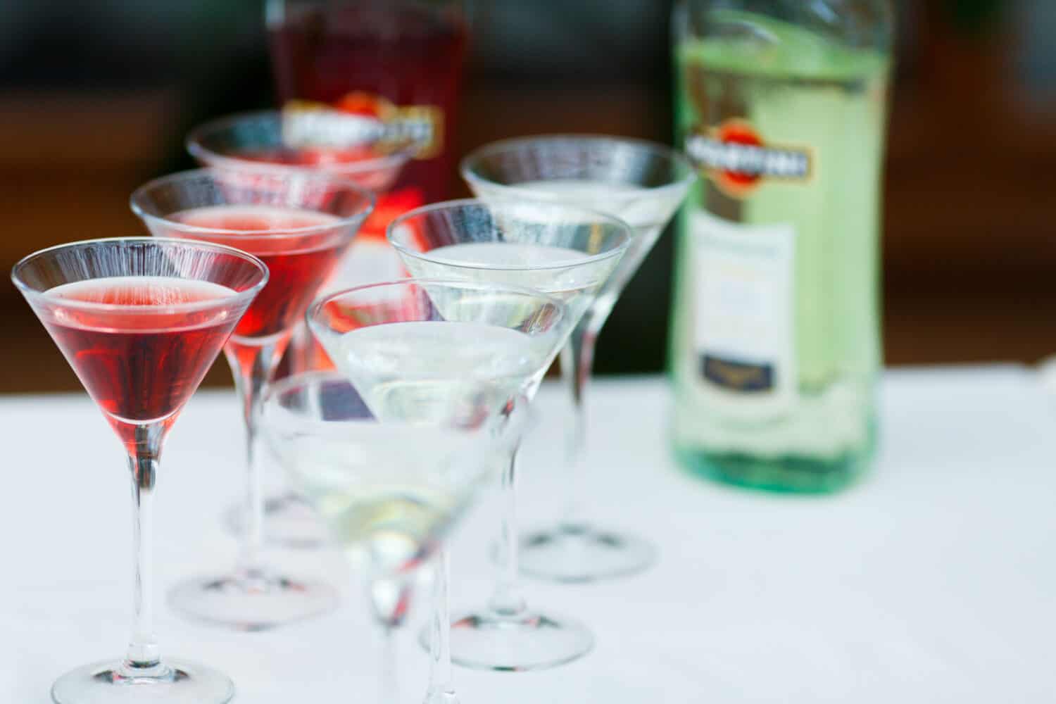 White and red martinin stand on the table in a restaurant