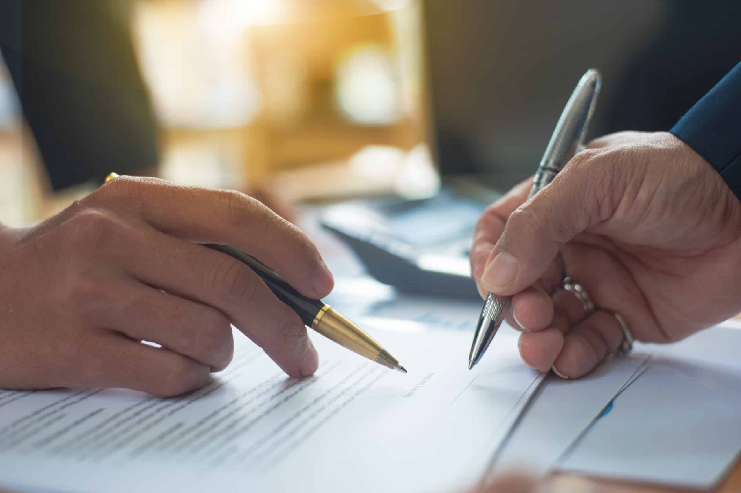 Close up of a business person who signs an agreement.