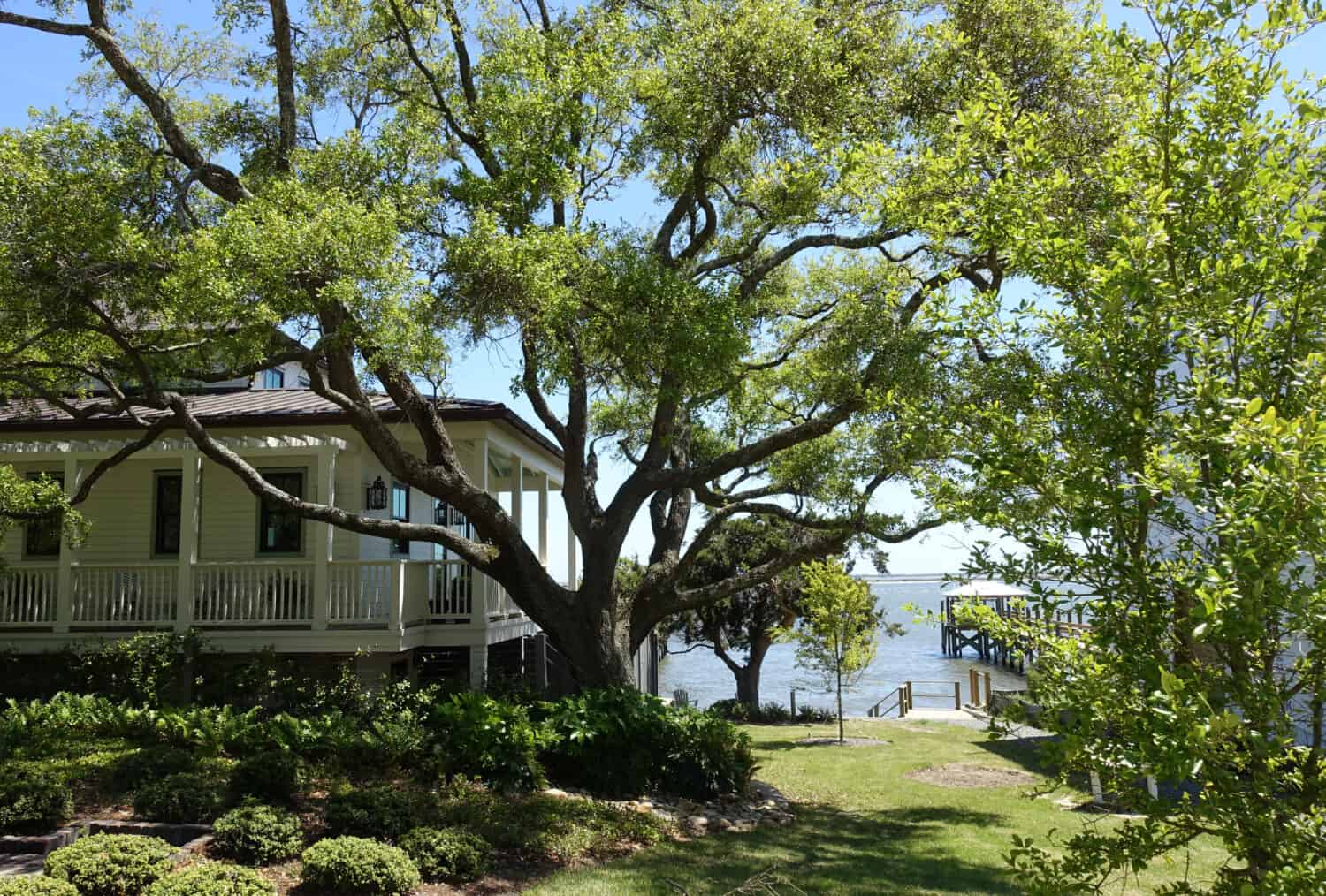 A peak of the ocean between homes in a Southport, North Carolina neighborhood