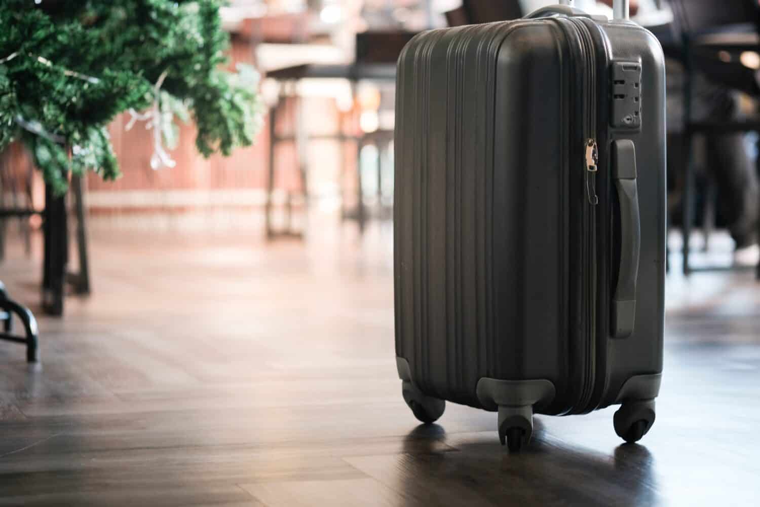 Large suitcases stand in the lobby of the hotel on the background