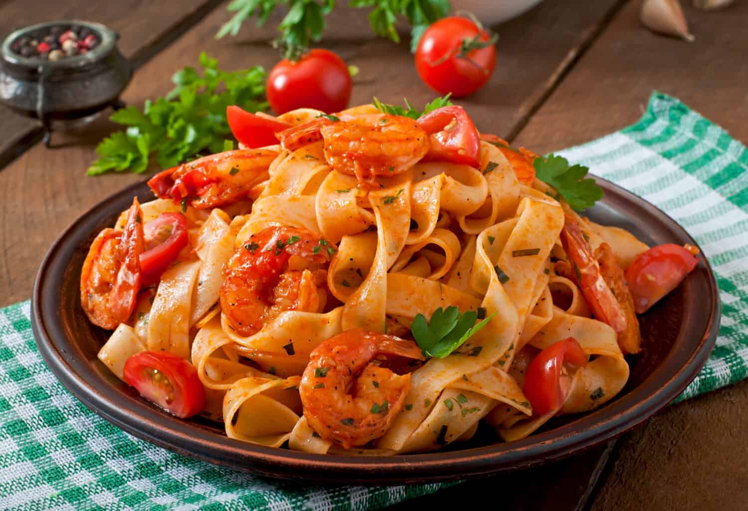 Fettuccine pasta with shrimp, tomatoes and herbs