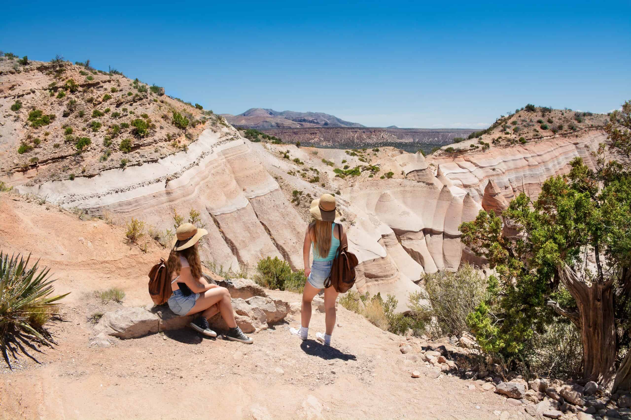 Santa Fe, NM people | Girs enjoying view on hiking trip in beautiful mountains.