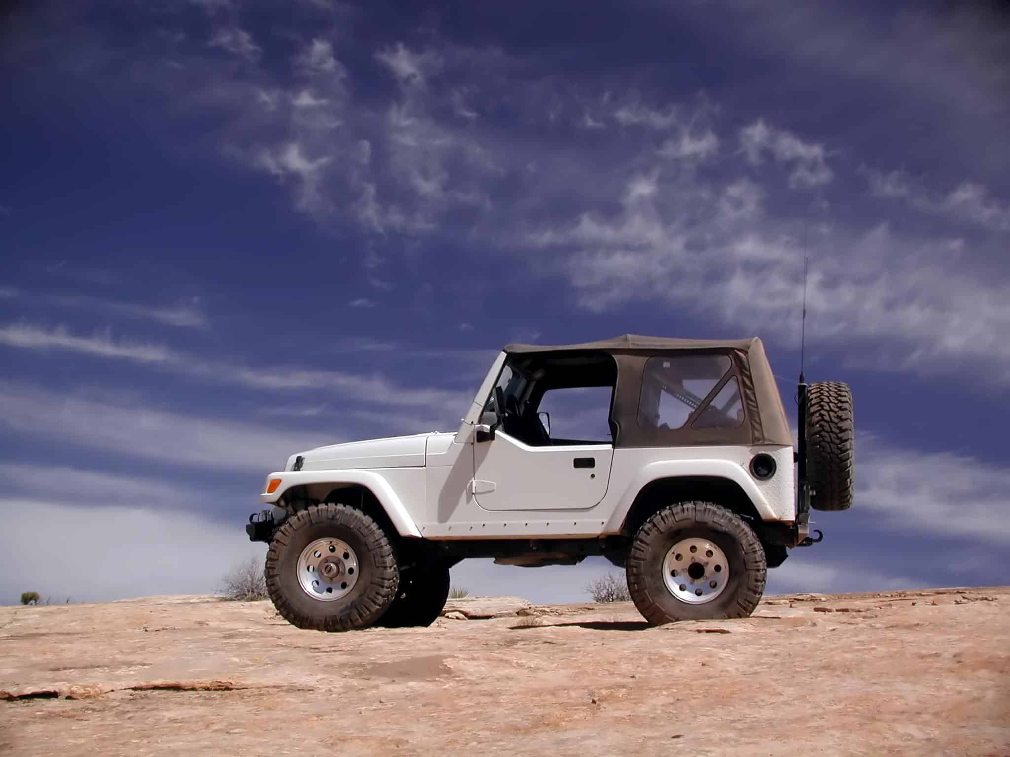 Jeep Wrangler | Jeep Wrangler on top of a sand dune