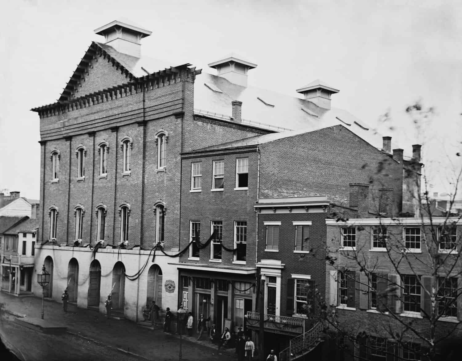 Abraham Lincoln&#039;s assassination took place in Ford&#039;s Theatre on April 14, 1865. Photo shows the post-assassination scene with guards posted at entrance and crepe draped from window.