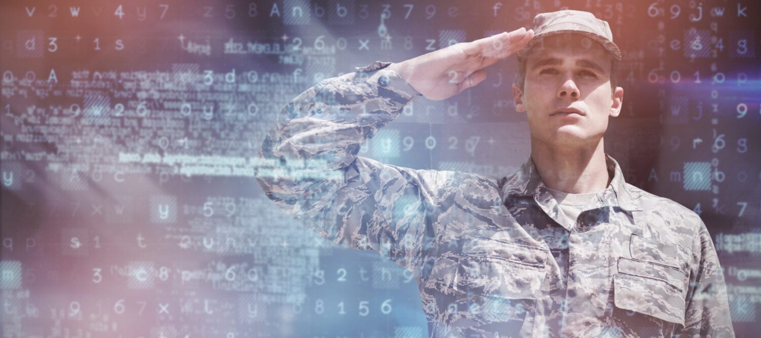 Dark room against portrait of military saluting