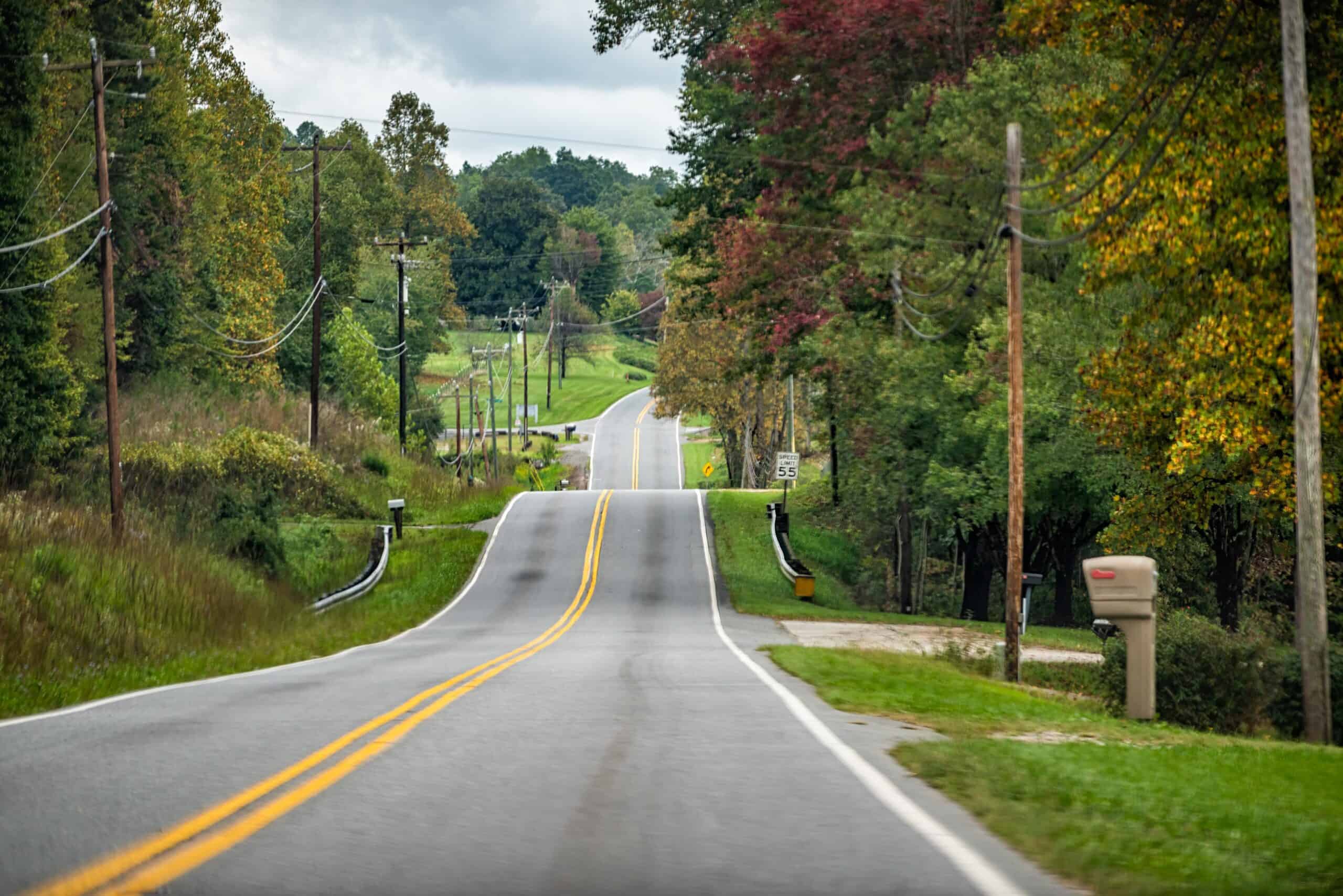 Marion, North Carolina | North Carolina scenic highway road in Blue Ridge Mountains with countryside rural country scenery in Marion, McDowell County on US-70 with rolling waves on steep curvy street