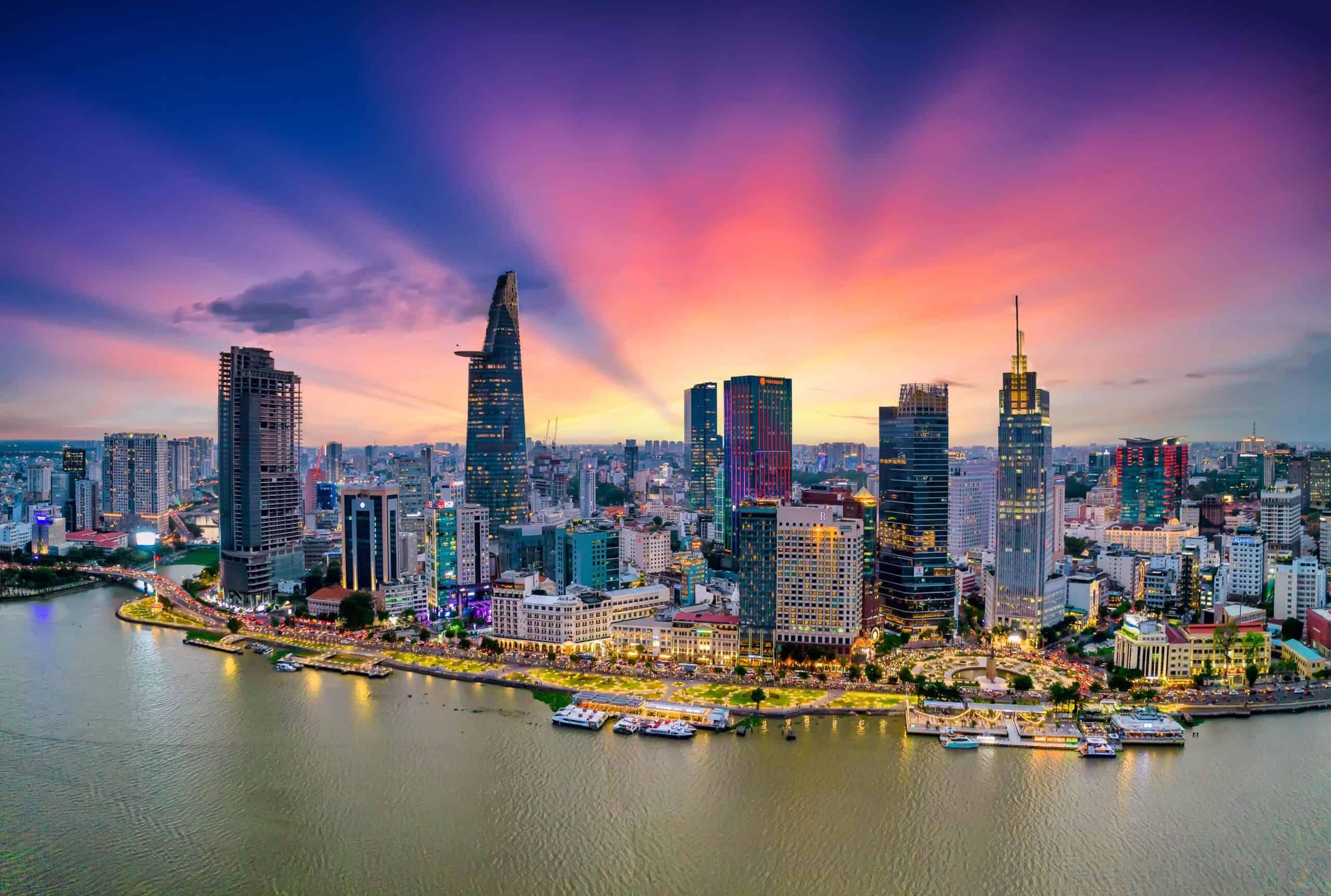 Vietnam | Aerial view of beautiful skyscrapers along the river at sunset sky