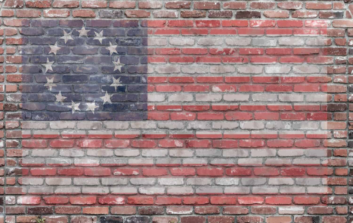 vintage first american flag on old brick wall