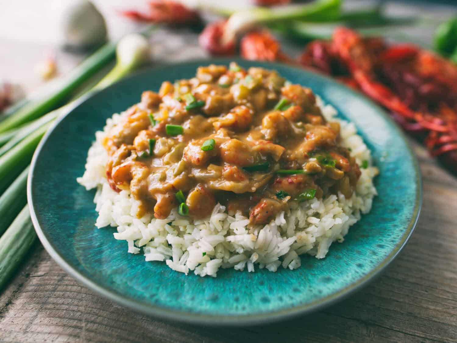 Crawfish étouffée served on a bed of rice.