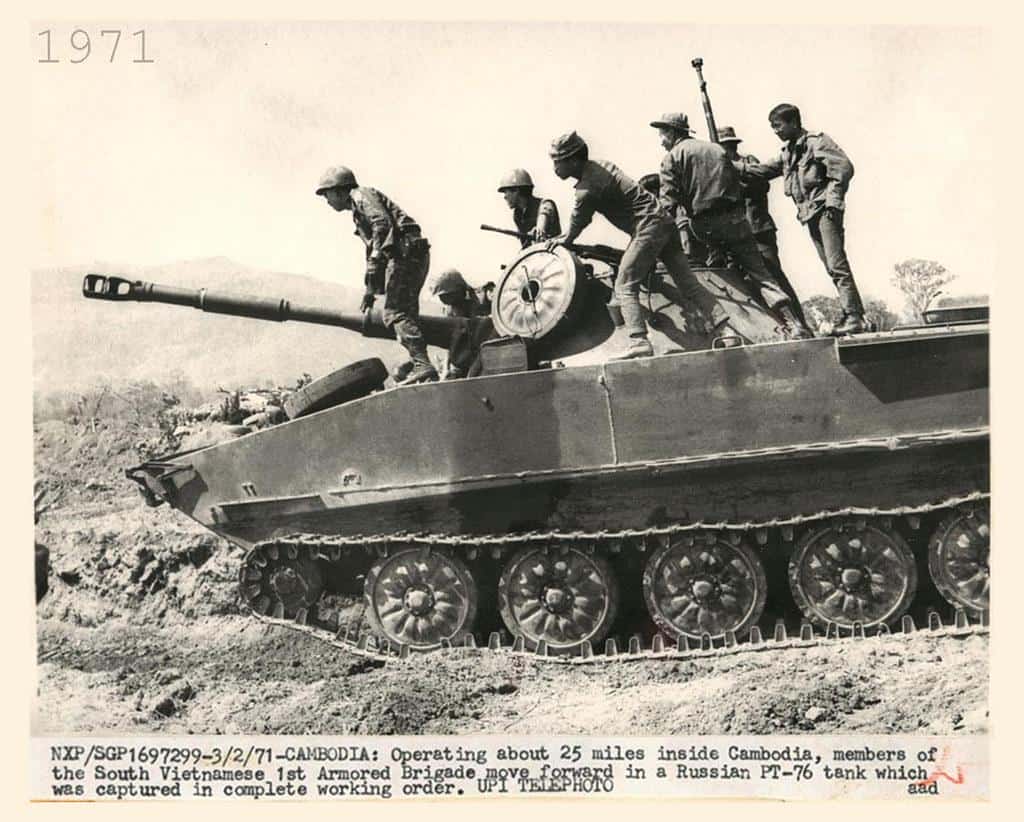 1971 South Vietnamese 1st Armored Brigade move forward in a captured Russian PT-76 tank. by manhhai