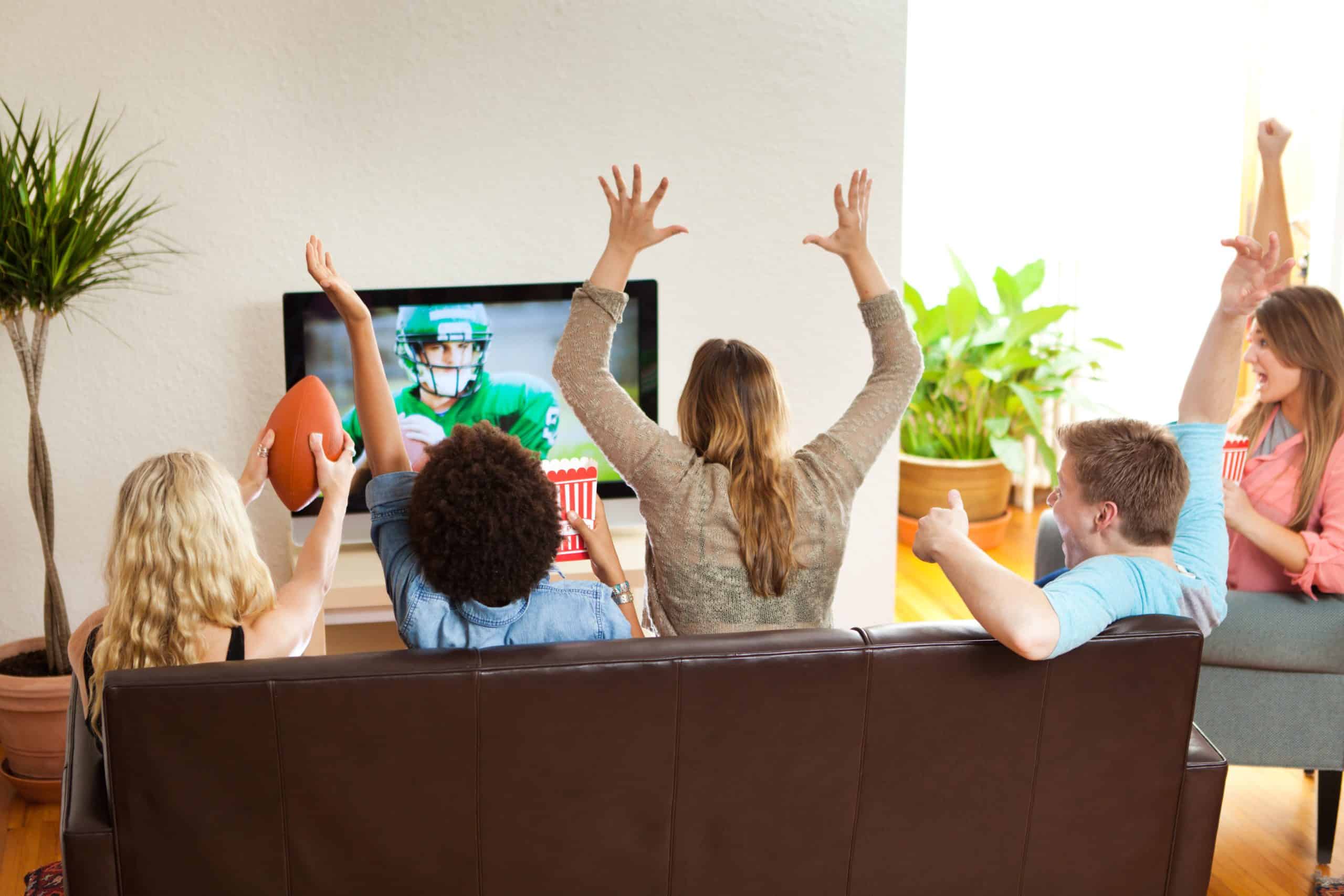 football on tv | Group of Friends Watching and Cheering Football Game Together