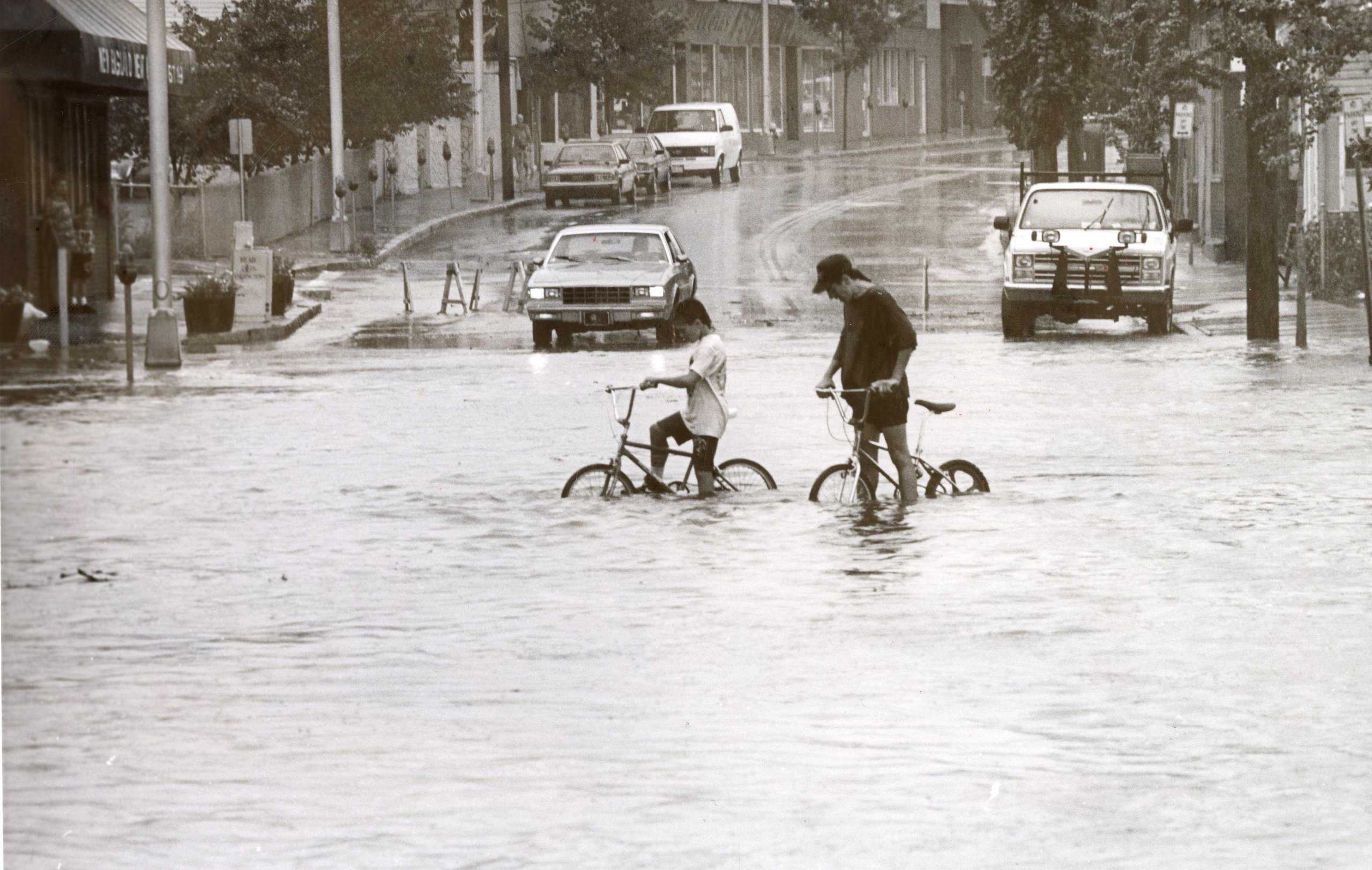 Kids Riding Bikes in Flood Wat... by Salem State University Archives and Special Collec