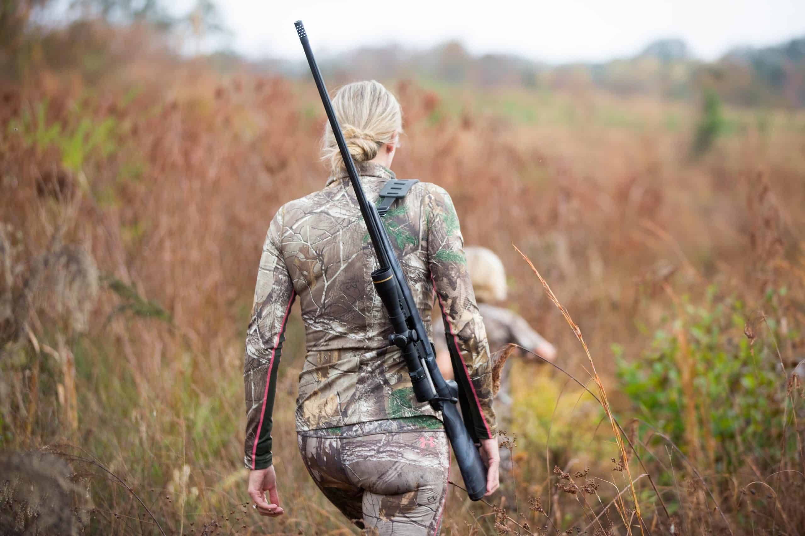 gun Alabama | Blond Mother with Rifle Walking in Field with Child Running Ahead