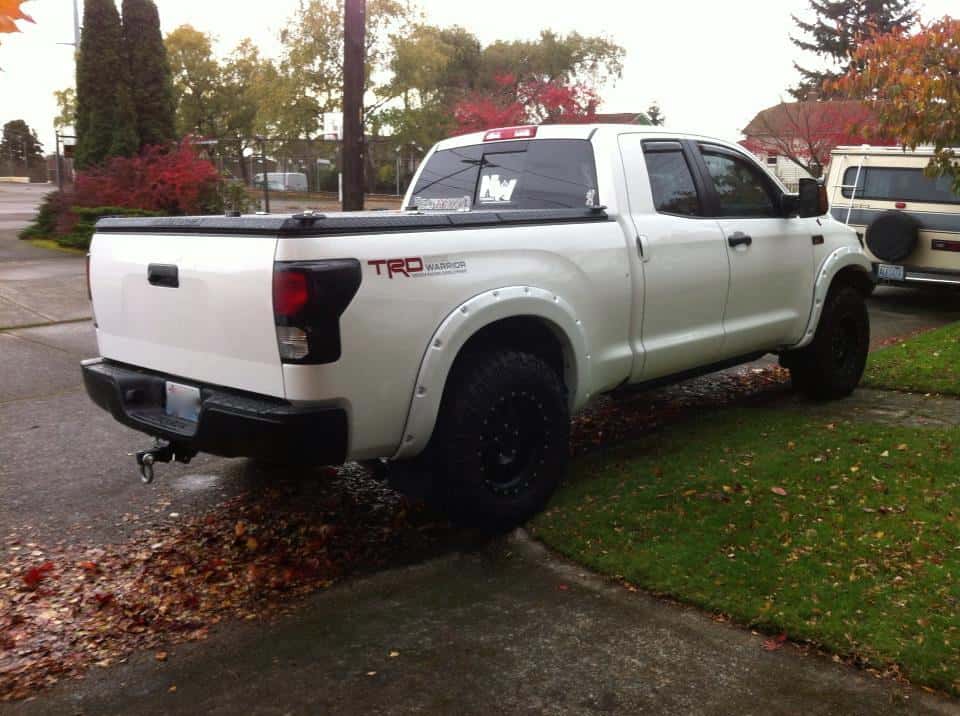 Toyota+Tundra | Black Folding Truck Bed Cover on White Toyota Tundra