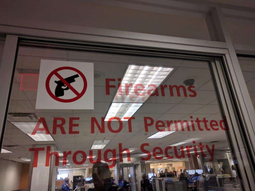 No guns allowed on planes sign, TSA checkpoint, Atlanta International Airport, Georgia, USA by gruntzooki