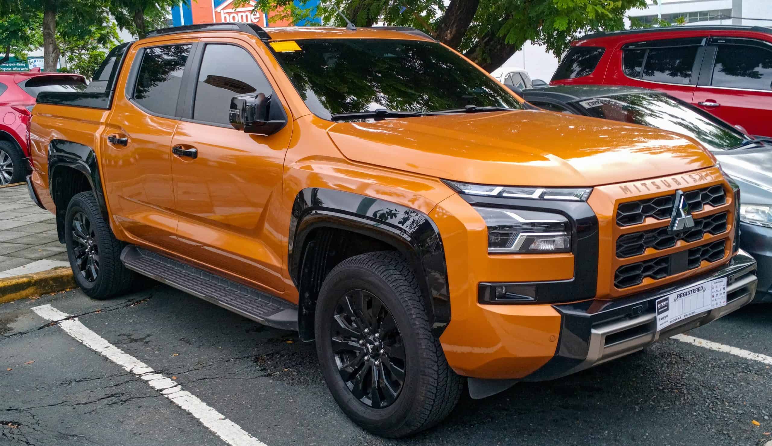 2024+Mitsubishi | 2024 Mitsubishi Triton 2.4 Athlete 4x4 in Yamabuki Orange Metallic, front right, 06-21-2024