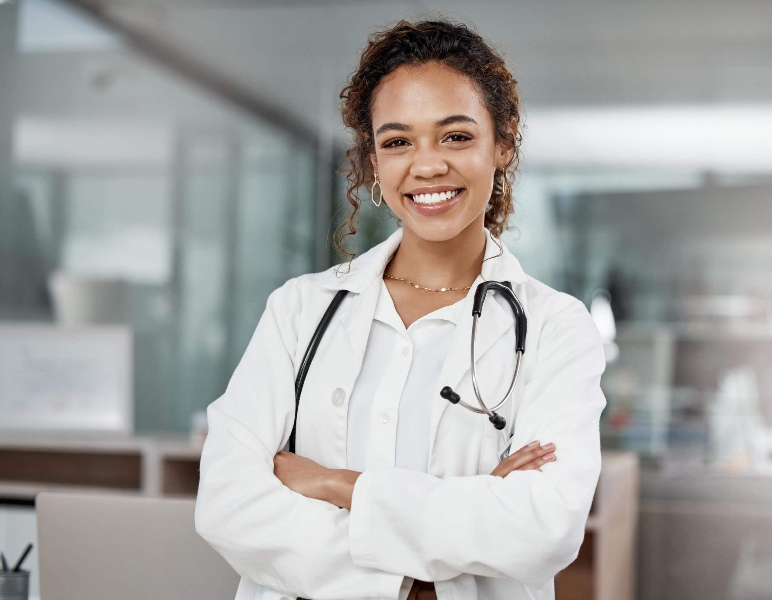 medical doctor | Cropped portrait of an attractive young female doctor standing with her arms folded in the office