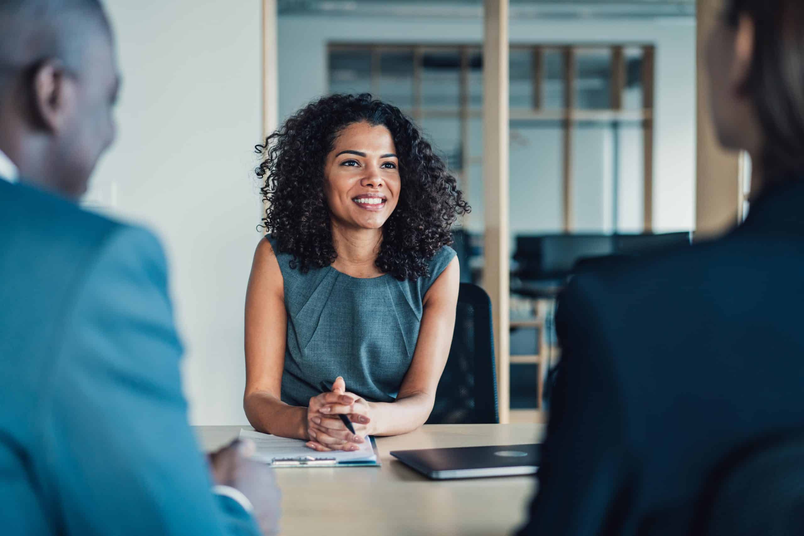 Financial planner | Group of business persons talking in the office.