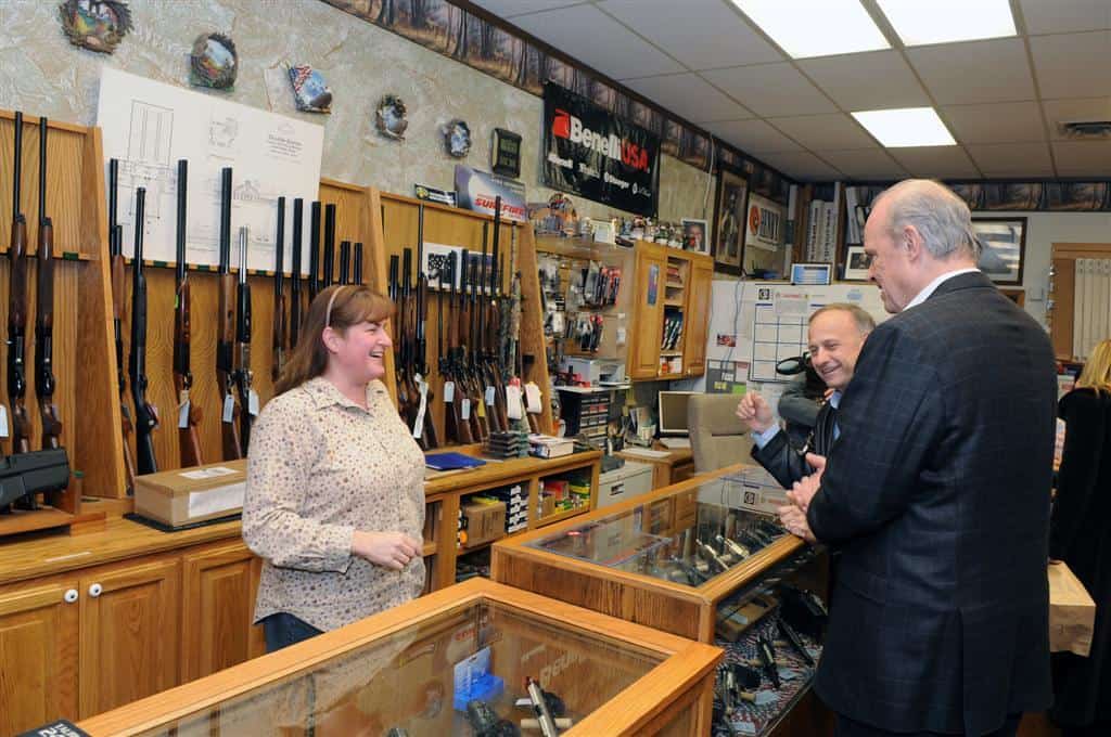 Checking out guns at the gun shop by freddthompson