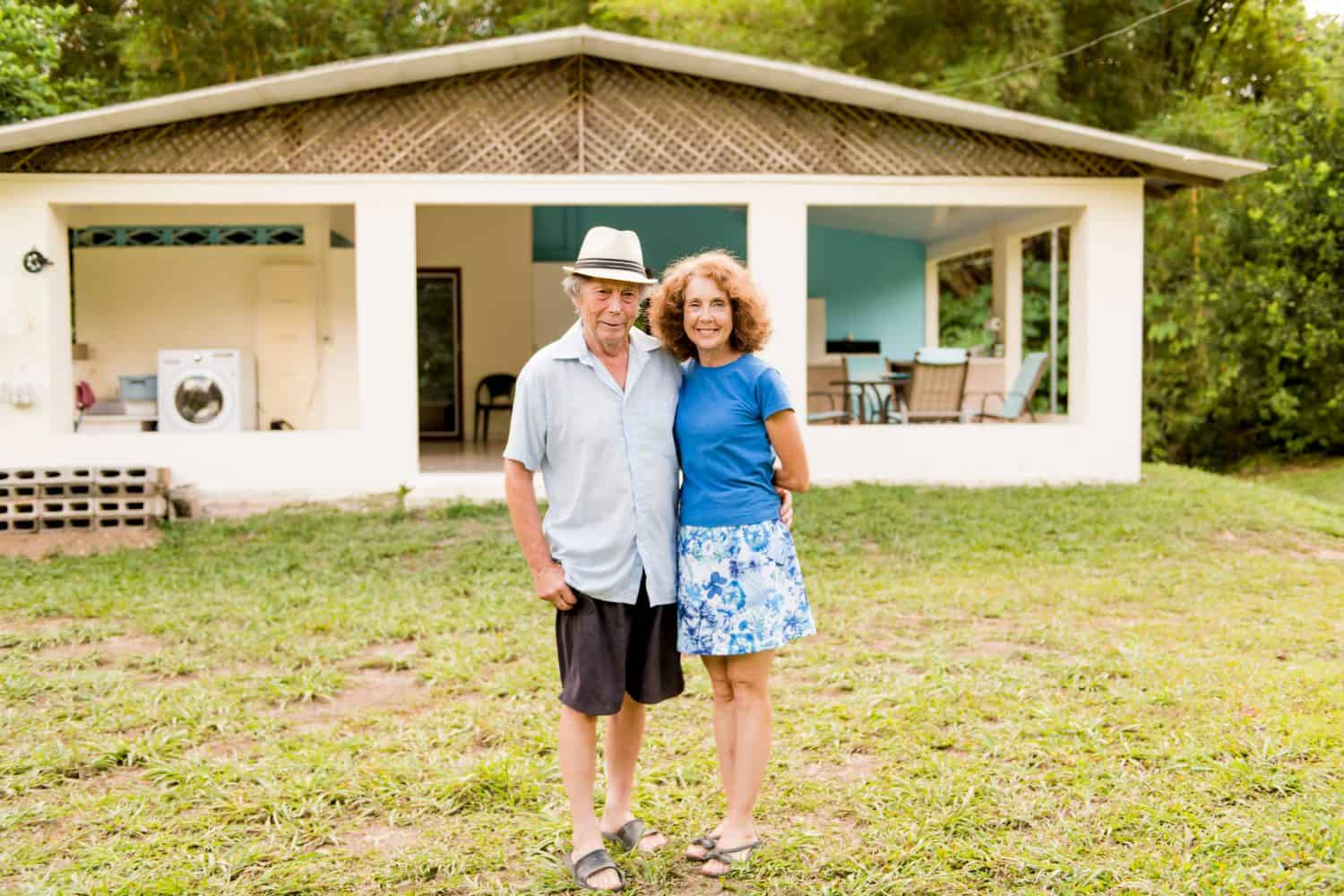 Portrait of a beautiful elderly couple standing embracing outdoors