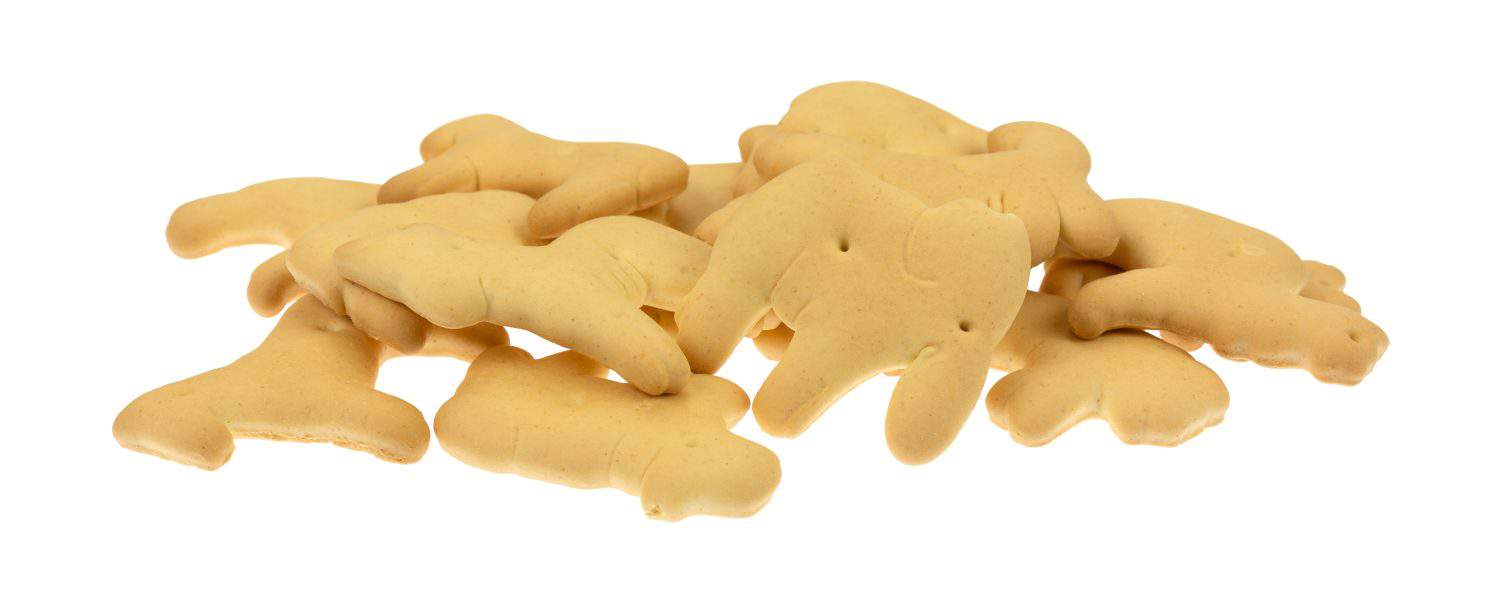 Side view of a small pile of animal crackers on a white background.