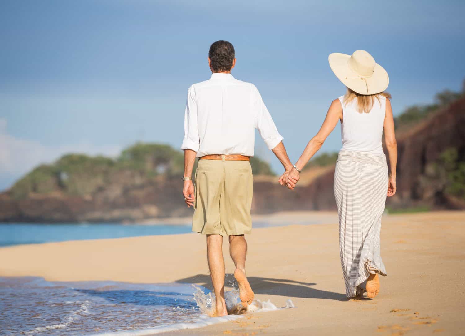 Happy senior couple on the beach. Retirement Luxury Tropical Resort