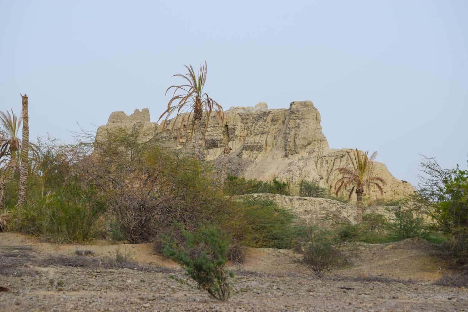 A historical place in Mir e Kalat near Turbat Kech with view of beautiful mountain, dates tree summer season Balochistan Pakistan photo