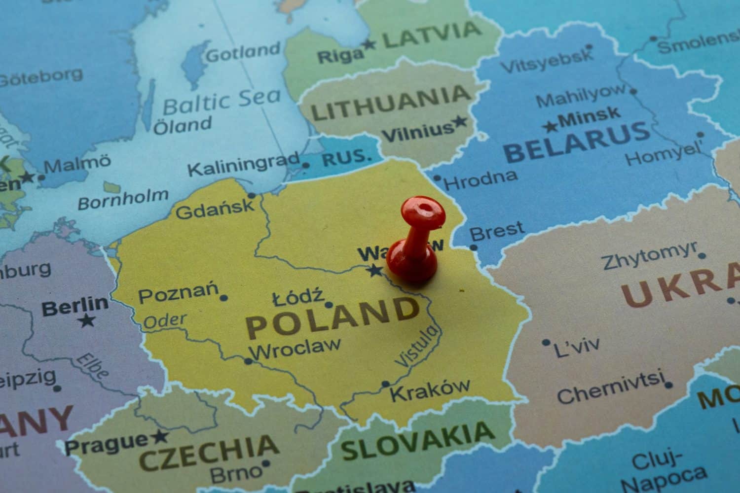 Poland location on map with red thumbtack, travel idea, Warsaw and Poland on map with a red fastener, vacation and road trip concept, pinned destination, top view