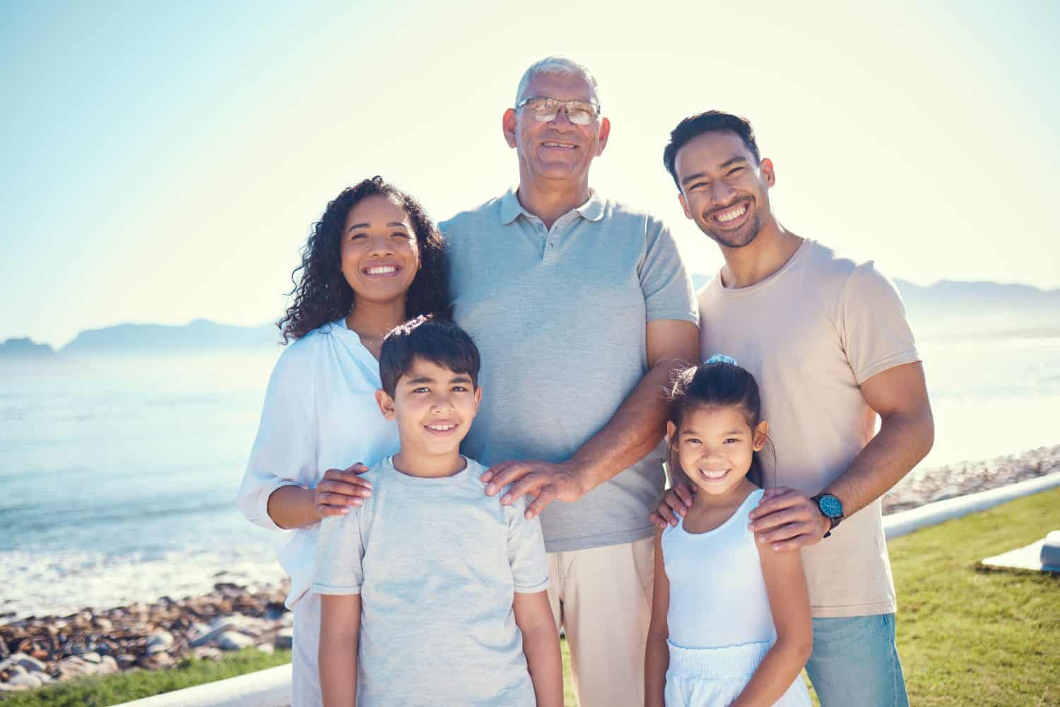 Love, happy and portrait of a big family on a vacation, adventure or weekend trip in Puerto Rico. Happiness, smile and children standing with their parents and grandfather at holiday resort or house.