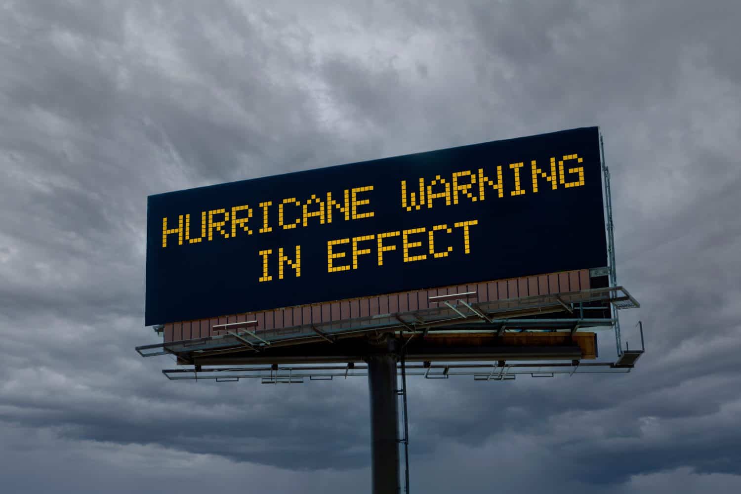 An electronic highway billboard with hurricane warning in effect message