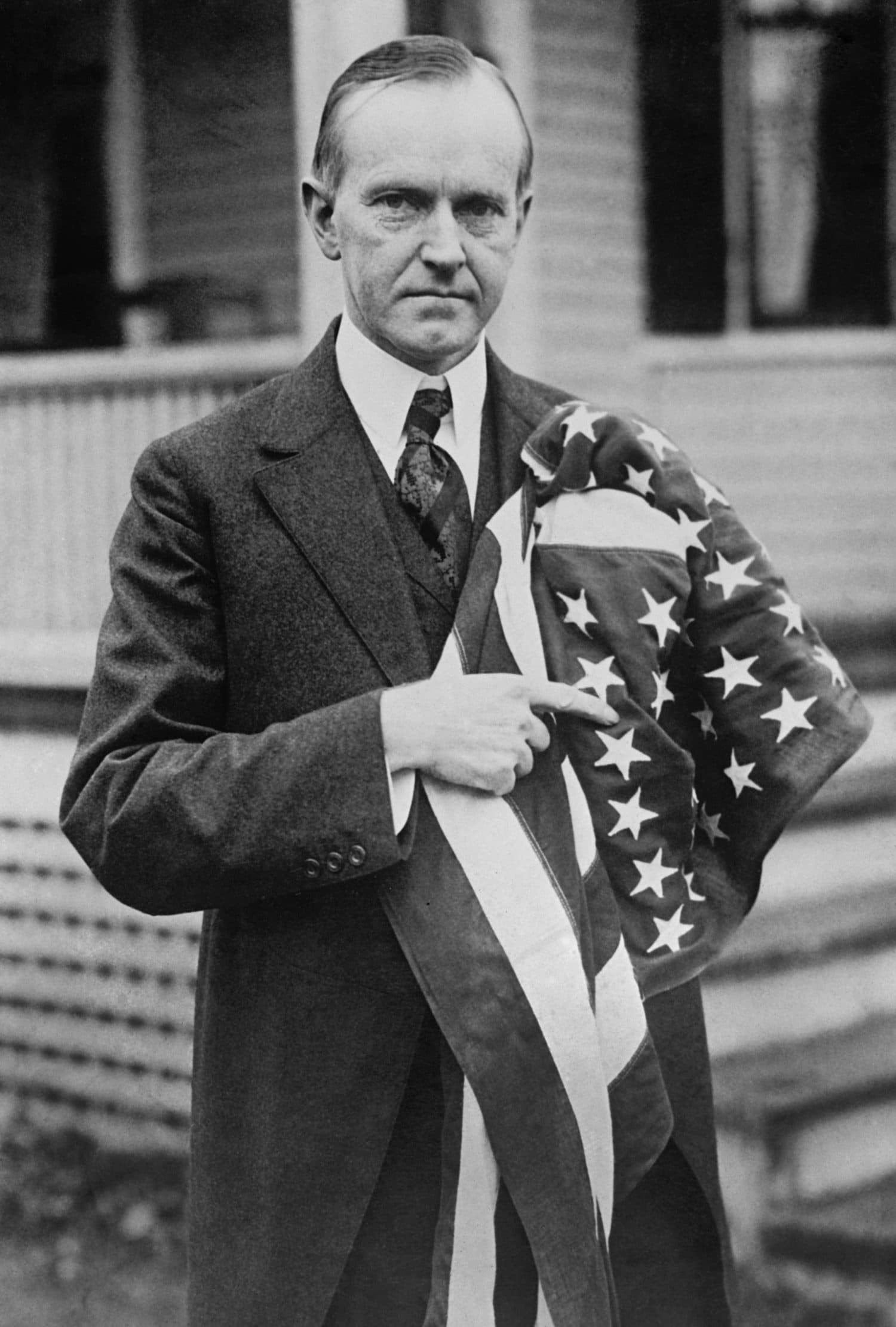 President Calvin Coolidge holding an American flag. May 2, 1924.