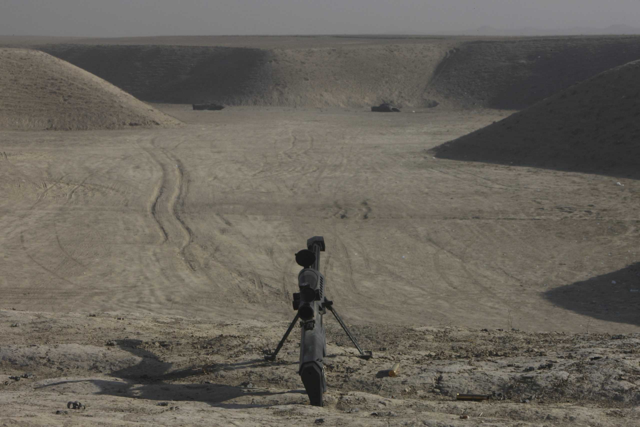 The Barrett M82A1 sniper rifle and spent cartridges on top of a wadi in Northern Afghanistan.