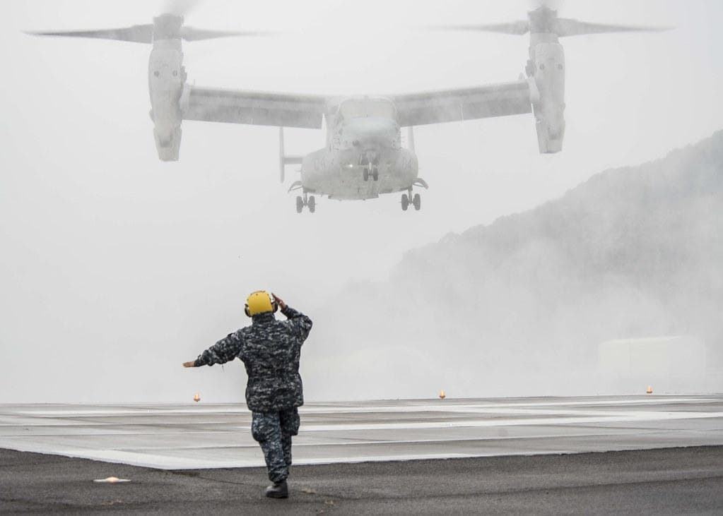 MV-22+Osprey | Sailor directs an MV-22 Osprey.