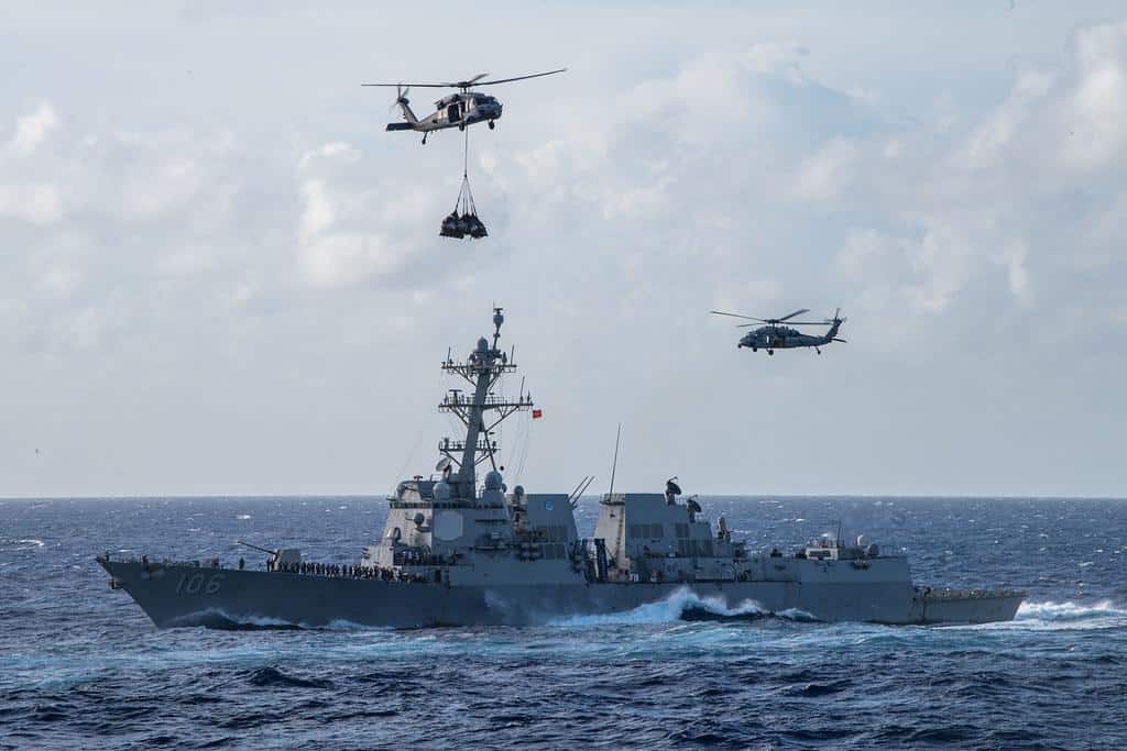 USS Stockdale (DDG 106) transits the Philippine Sea as two MH-60S Sea Hawk helicopters conduct a vertical replenishment-at-sea. by Official U.S. Navy Imagery