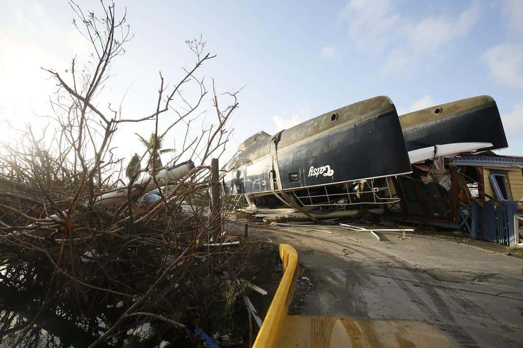 An upturned catamaran yacht partially blocks the entrance to the marina of Nanny Cay on the British Virgin Island of Tortola. The Caribbean island suffered widespread damage and destruction when Hurricane Irma passed over on 6 September 2017. by DFID - UK Department for International Development