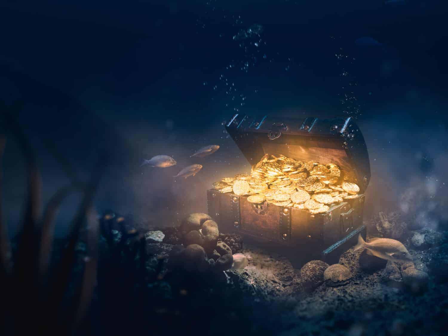 Open treasure chest sunken at the bottom of the sea / high contrast image