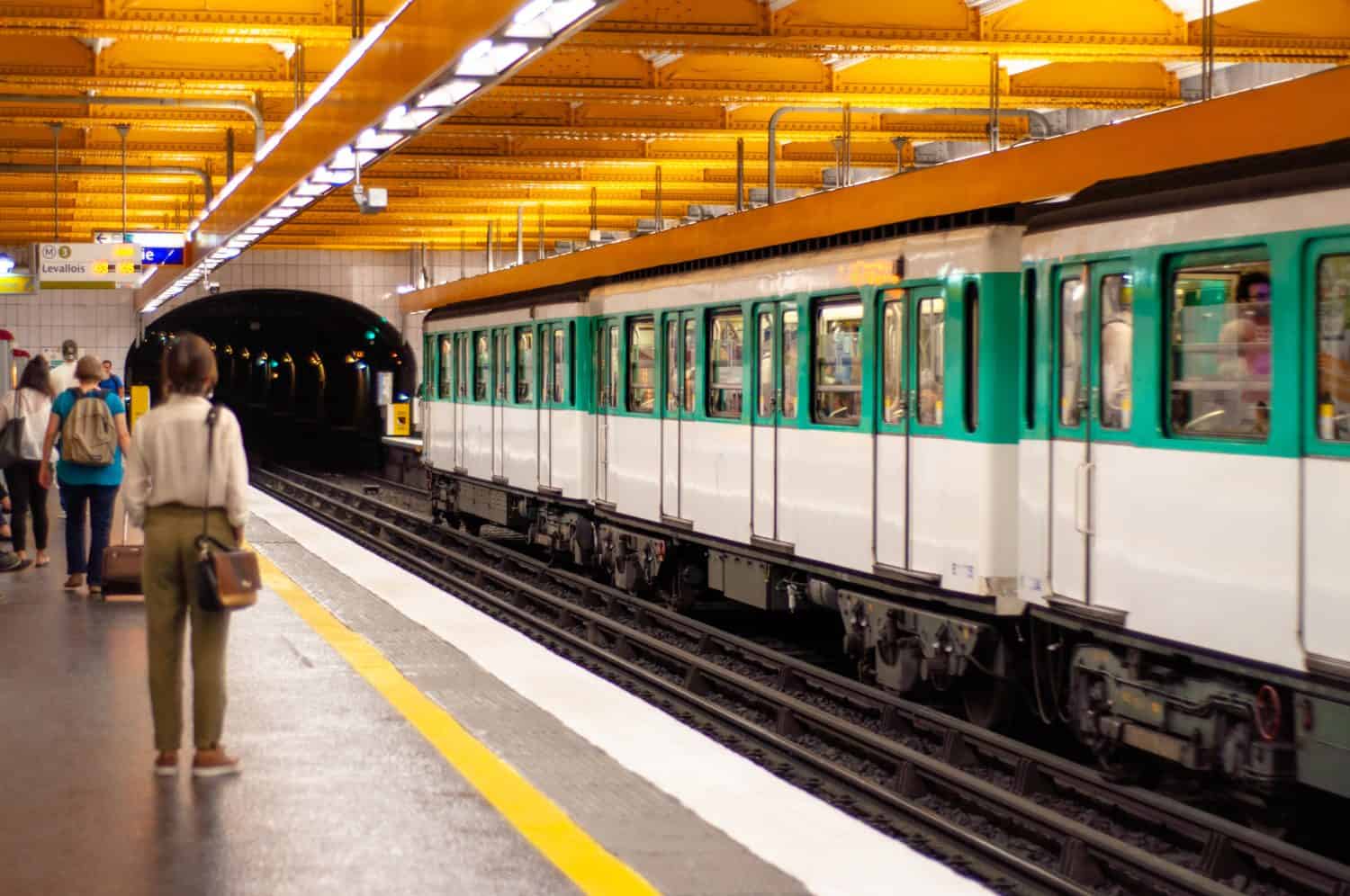 Subway station at Paris, people waiting the train at the platform