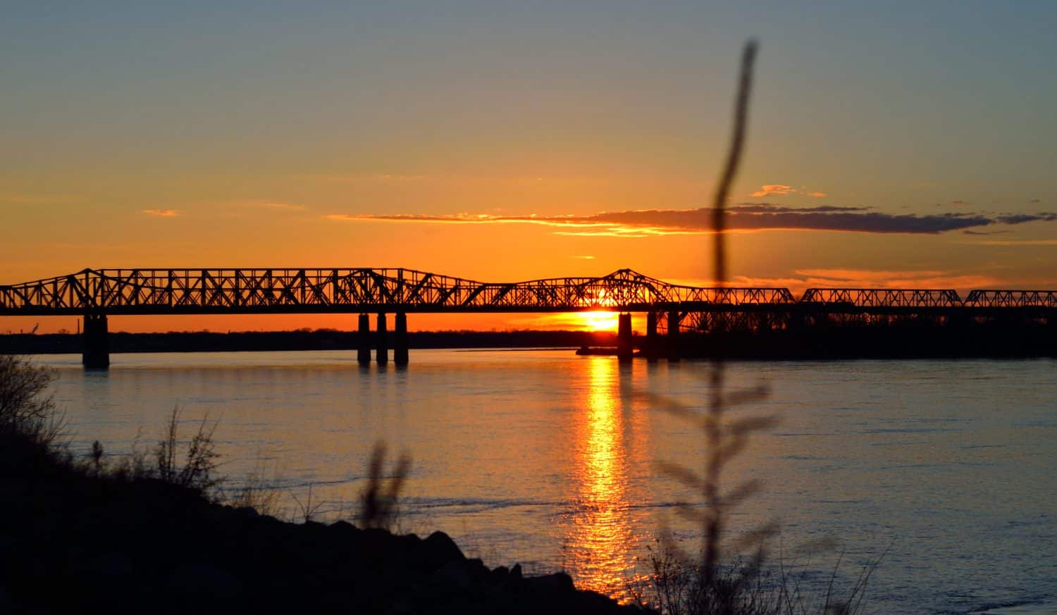 sunset at Memphis-Arkansas bridge over mississippi river