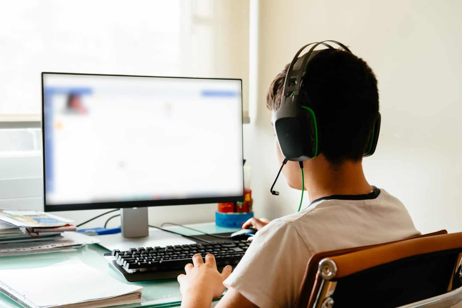 Teenager is studying at home attending online classes during the coronavirus COVID-19 pandemic quarantine. Madrid, Spain