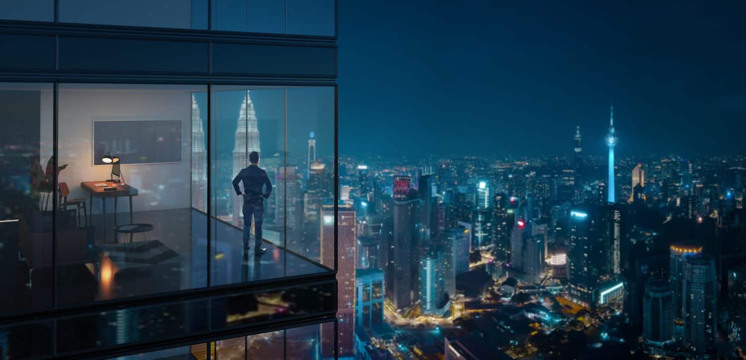 Young business man standing in the 3d rendering office watching the modern city night view, view from the outside. Business ambition concept.