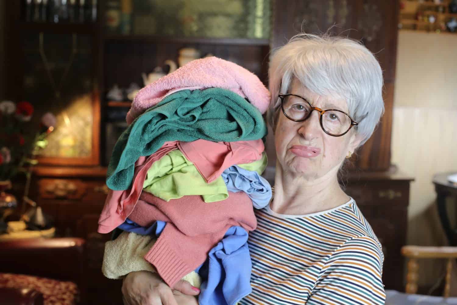 Senior woman who really dislikes doing laundry