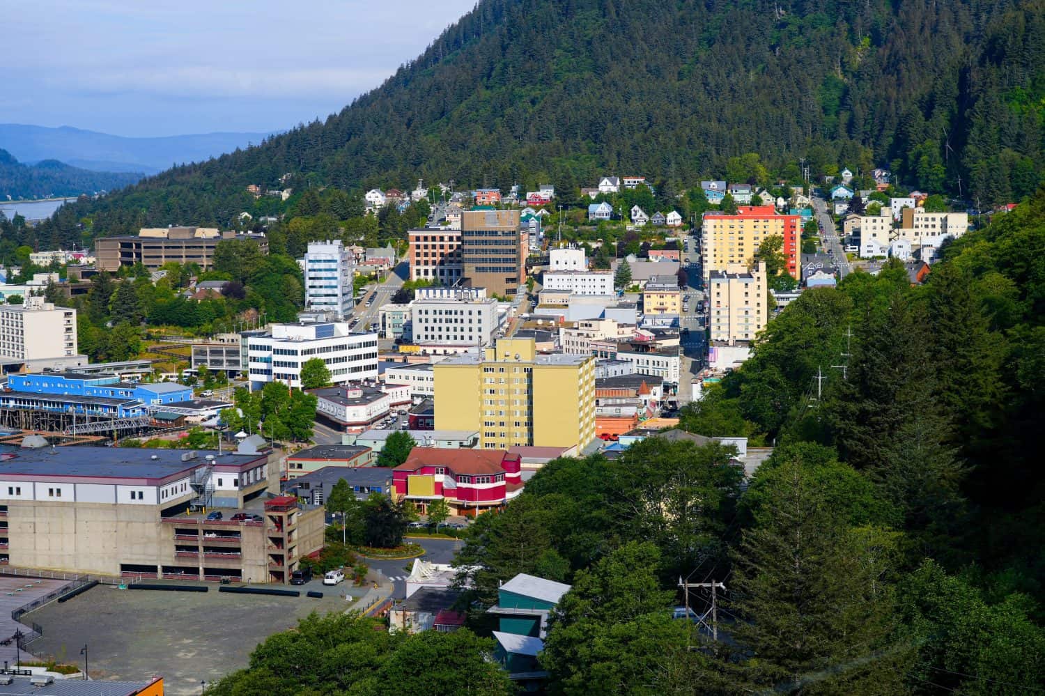 Aerial view of the historic city center of Juneau, the capital city of Alaska, USA - State capitol and State Courthouse of Alaska surrounded by wild mountains covered with forests