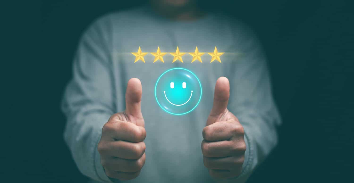 Customer experience satisfaction concept. Hands of client thumb up positive emotion smile face icon and five star. Standardization and quality in products and services. Excellent services rating